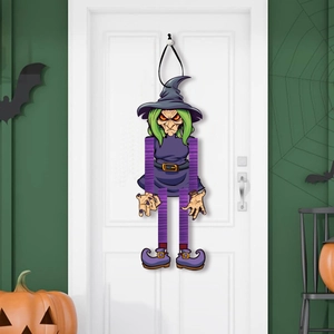 Detail of cartoon witch door hanging decoration with green hair and purple hat