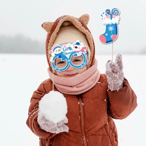 Winter Christmas photo booth props with blue glasses and snowflake stocking for kids