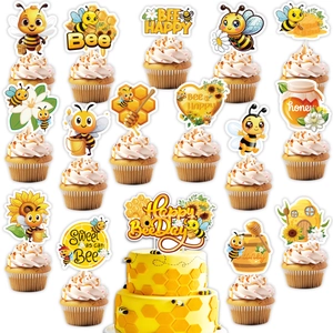 Macro view of bee-themed cupcake toppers and cake picks for kids birthday parties