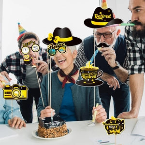 Funny retirement party photo booth props with signs like No More Mondays and sunglasses