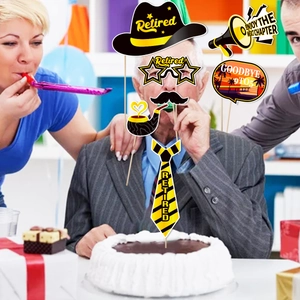 Close-up of funny retirement party photo booth props with signs and accessories