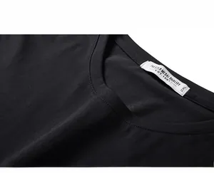 Detail shot of the tight stitching and soft fabric on a black cotton crewneck t-shirt