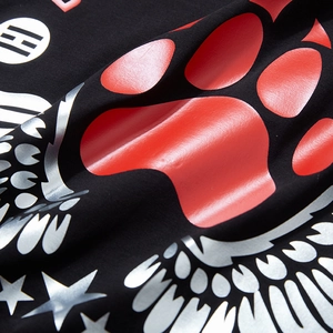 Oversized black cotton T-shirt with red paw print and silver wing graphic design