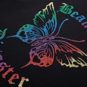 T-shirt noir surdimensionné avec motif de papillon pailleté coloré et texte imprimé