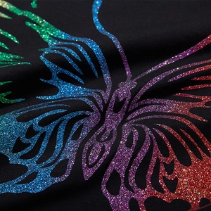 T-shirt noir oversize en coton avec imprimé papillon pailleté aux reflets arc-en-ciel