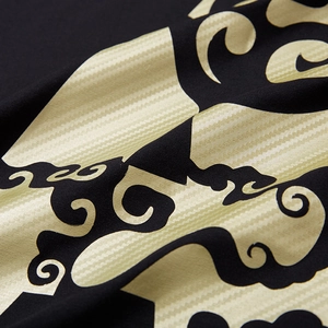 Loose fit black cotton T-shirt with large golden cloud print and textured pattern