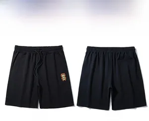 Détails du short de sport noir en coton avec broderie ours et taille élastique à cordon