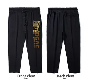 Vorder- und Rückansicht der schwarzen Jogginghose mit goldenem Tigerkopf und Kordelzug