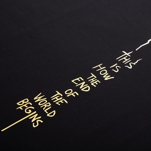 Oversized black cotton T-shirt for men featuring artistic gold foil letter printing