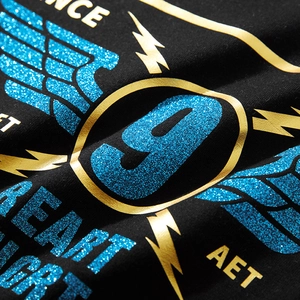 Black oversized T-shirt with blue glitter wing print and gold foil metallic details