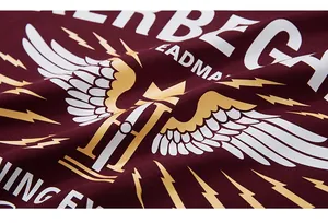 Detail of street-style print on dark red cotton fabric with smooth silk-screen printing