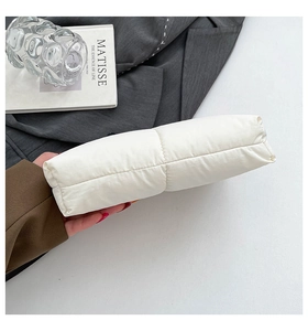 Detailed close-up of the quilted white cotton cloud bag with elegant diamond lattice stitching