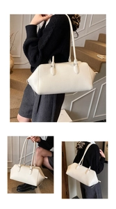 Minimalist white litchi pattern leather shoulder bag shown in a professional lifestyle setting
