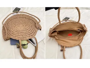 Detail view of woven straw tote bag featuring internal lining and functional zipper pocket