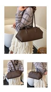 Detail of dark brown lychee leather handbag showing large capacity and dual straps