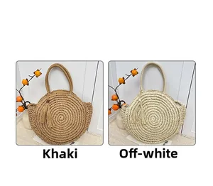 Detail showing handwoven straw shoulder bags with tassel charms in khaki and cream white colors