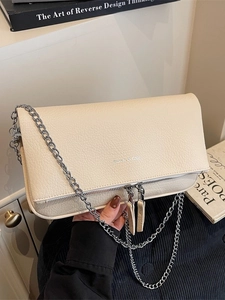 Beige textured leather flap chain bag with silver metallic strap and minimalist design