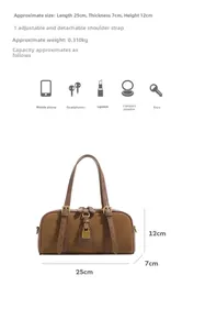 Detailed view of brown Boston bag with dimensions 25x7x12cm and detachable strap