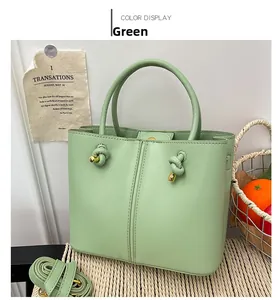Detailansicht der hellgrünen Leder-Tote-Bag mit Knotendetail und Gold-Hardware