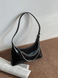 Chic black lychee grain crescent shoulder bag with elegant silver double chain straps
