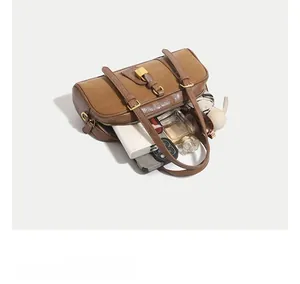 Spacious interior of dark brown leather Boston bag showing daily storage capacity