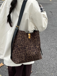 Retro leopard print bucket tote bag with black leather strap and gold metal lock