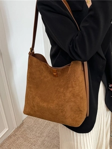 Retro suede bucket tote bag in caramel brown featuring a large capacity and metal swivel lock