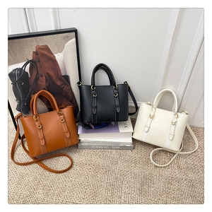 Chic trapezoid buckets bags in brown, black, and beige with gold ring details and straps