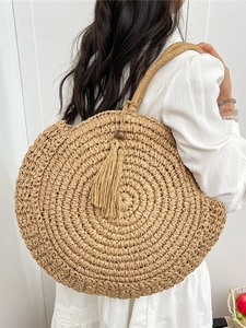 Large round straw shoulder bag with tassel, woven bohemian style for beach travel