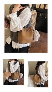 Brown lychee leather bucket bag set with metal lock and cute rabbit plush charm
