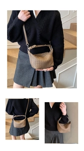 Detail view of brown woven leather crossbody bag with adjustable strap and silver buckles