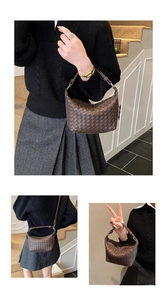 Detailed view of dark brown woven leather handbag with intricate Intrecciato texture