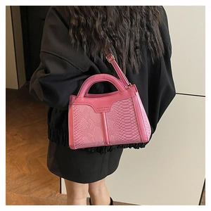 Pink snake pattern crossbody bag with Fashion & Bags logo and gold trim detail