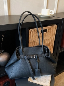 Retro black leather tote bag with buckle detail and long shoulder straps for daily commute
