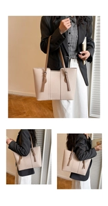 Close-up of litchi grain texture and adjustable straps on a beige leather tote bag
