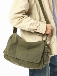 Army green washed canvas messenger bag with a vintage crossbody design for casual daily use