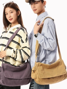 Minimalist washed canvas messenger bag in purple and khaki with wide shoulder strap