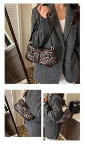 Detailed view of leopard print shoulder bag with silver studs and brown leather trim