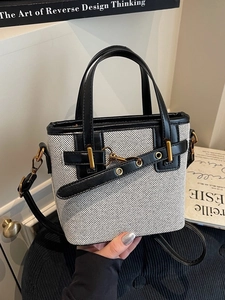 Elegant black and white contrast canvas tote bag with leather trim and gold hardware