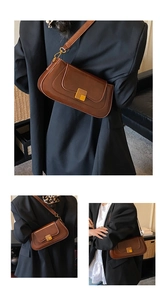 Detail der braunen Vintage-Baguette-Tasche mit goldener Metallschnalle und Schultergurt