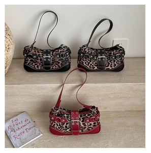 Three leopard print shoulder bags in black, dark brown, and red with rivet buckle details