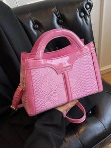 Pink snakeskin pattern small square bag with top handle and adjustable shoulder strap