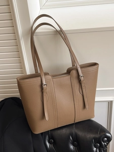 Classic large khaki leather tote bag for women with adjustable straps and zip closure