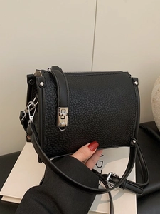 Retro black faux leather shoulder bag with silver turn-lock and lychee texture