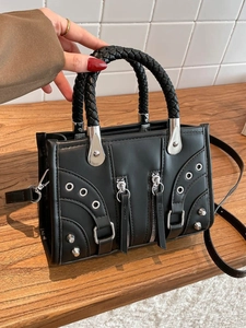Vintage black rivet underarm bag with woven handle and motorcycle style details