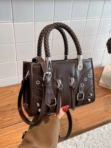 Vintage dark brown rivet shoulder bag with woven handle and silver hardware detail