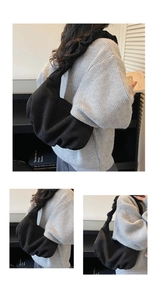 Detail of minimalist black pleated suede tote bag with soft texture and hobo design
