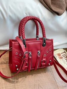 Vintage red rivet underarm bag with braided handles and silver punk metal hardware
