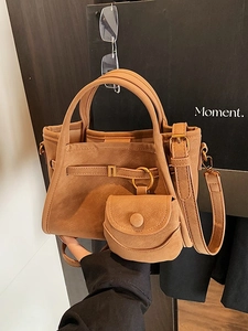 Retro brown suede bucket bag with dual handles and a mini round coin purse pendant