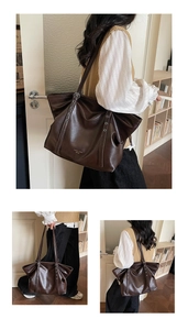 Detailansicht der großen dunkelbraunen Leder-Tote mit Metallösen und weicher Textur